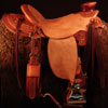Douglas 38 Wade - tree by Rick Reed, 15 and 1/4 inch seat, Gullet - 7 and 1/2 inch by 6 and 1/4 inch by 4 inch, Horn 3 inch round, 90 degree bars, 7/8ths flat palte riggin, Cheyenne Roll, Sheridan Style Floral Carving bordered with Vaquero Lace.